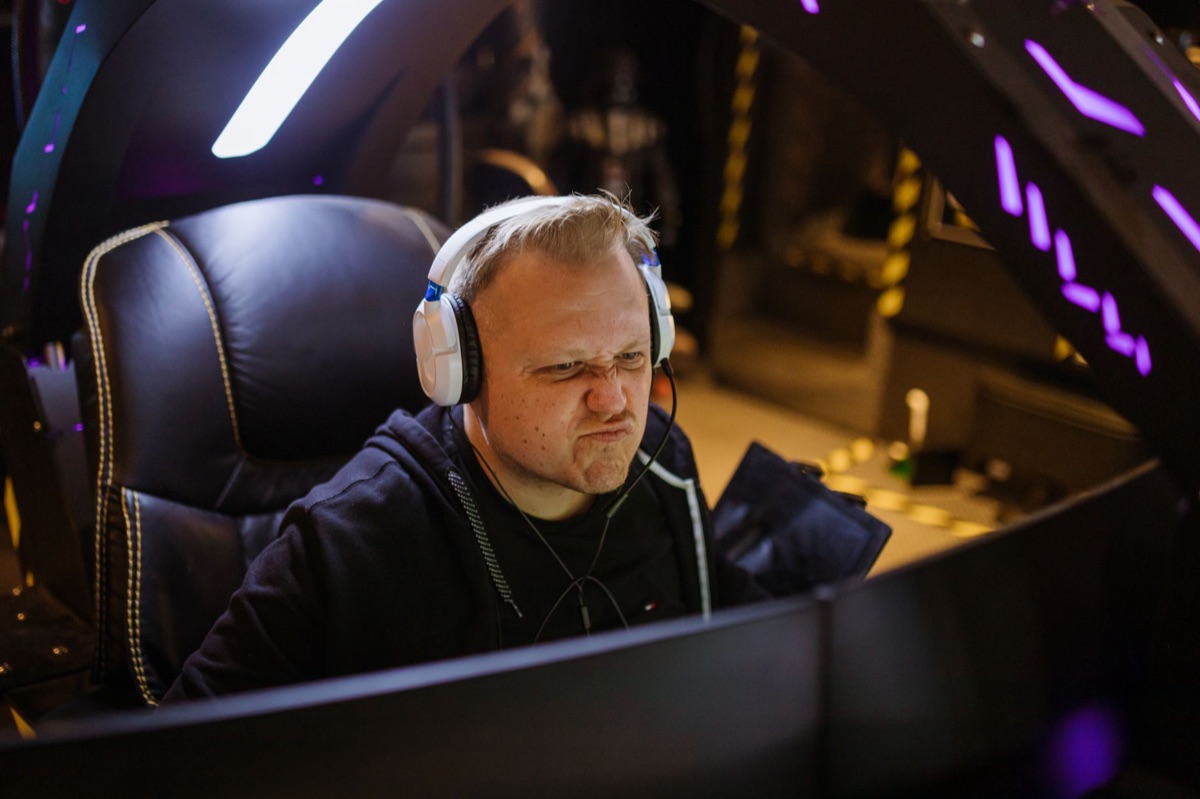 pro gamer wearing custom headset and keyboard setup
