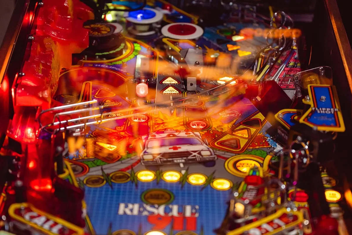 pinball game, pinball machine, rescue 911, play, pinball, skill game, reaction, lights, shining, metal ball, indoor, modern, pinball machine, pinball, pinball,