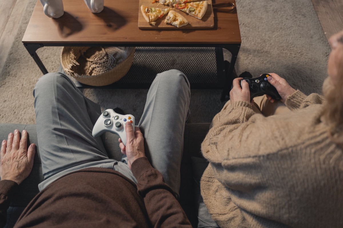 people playing Wii console in living room